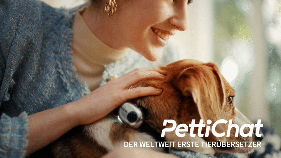Woman holding cat with PettiChat collar